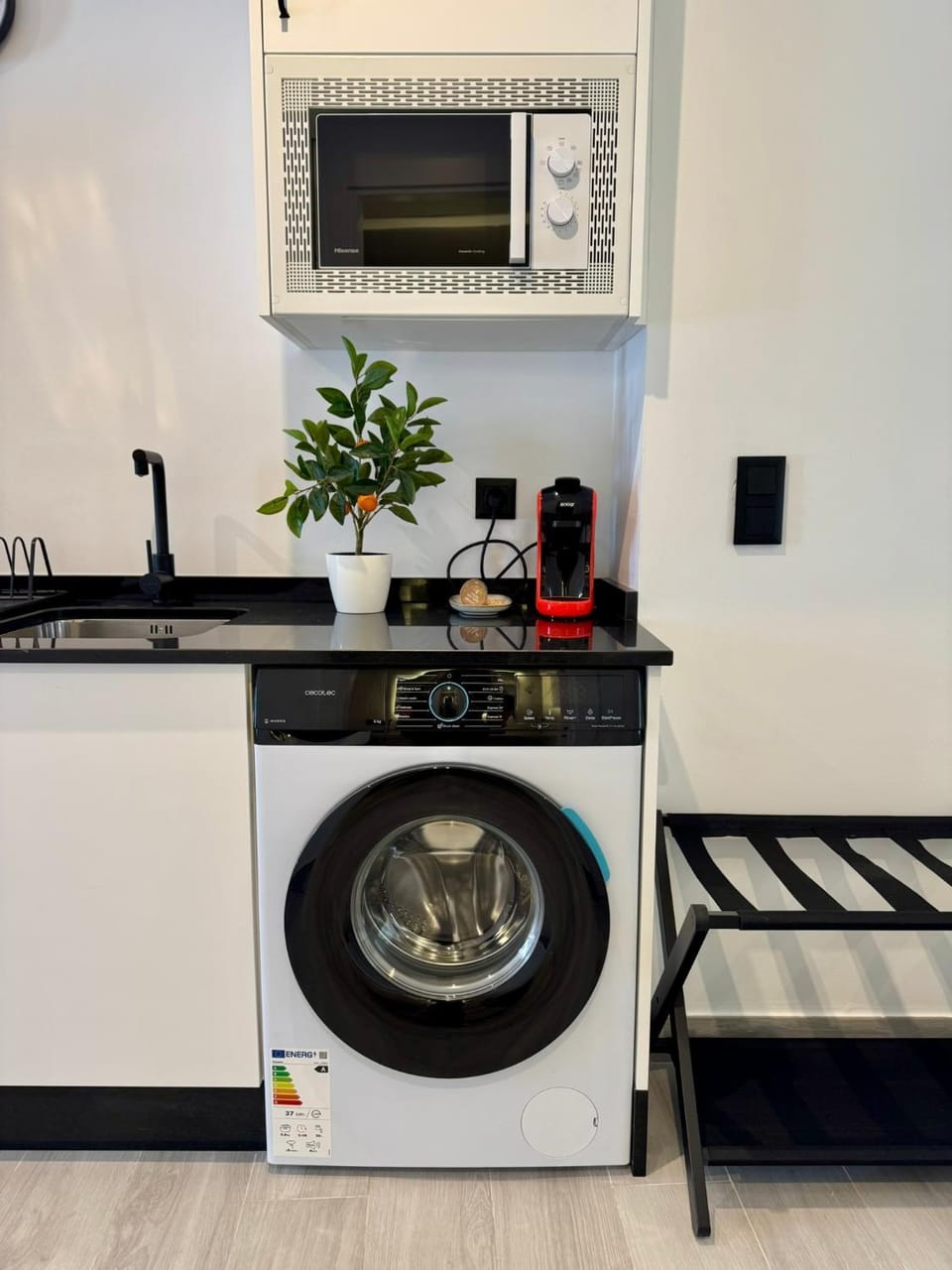 Kitchen or kitchenette, microwave, stove, washing machine, kitchen