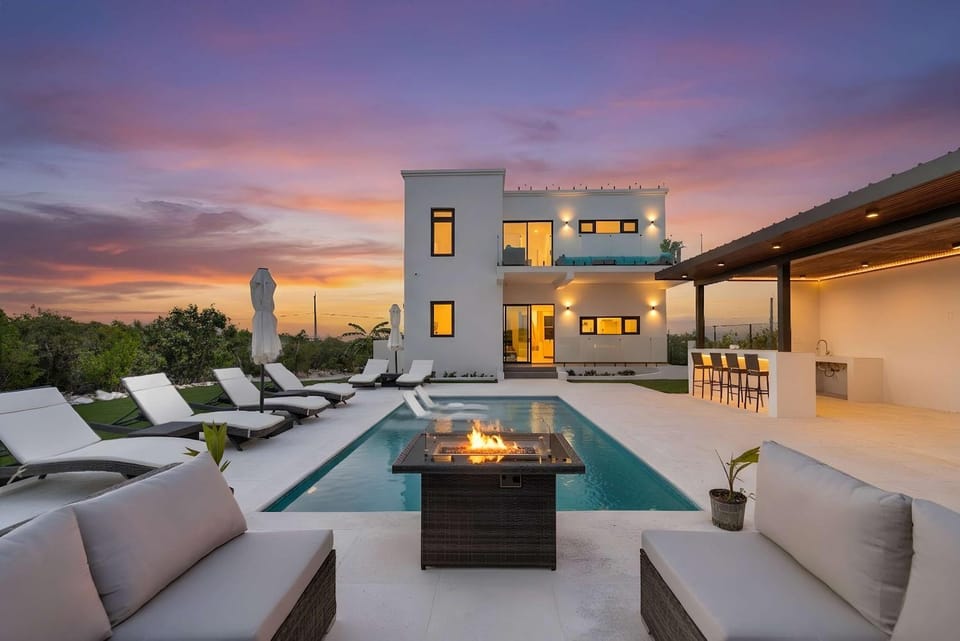 Property building, Patio, Seating area, Swimming pool, Sunset, fireplace, sunbed
