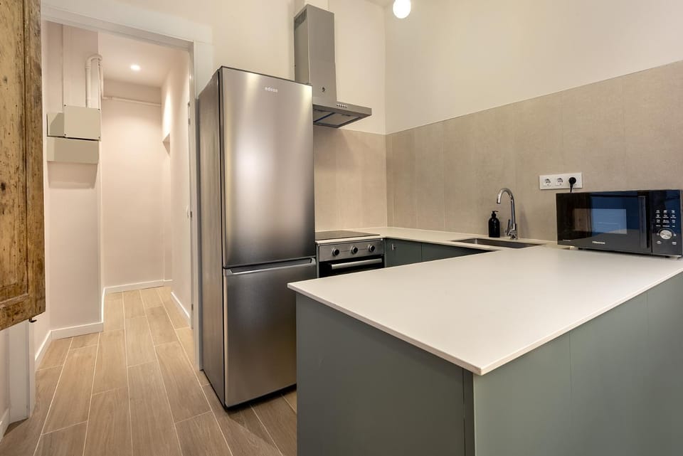 Kitchen or kitchenette, dishwasher, microwave, oven, stove