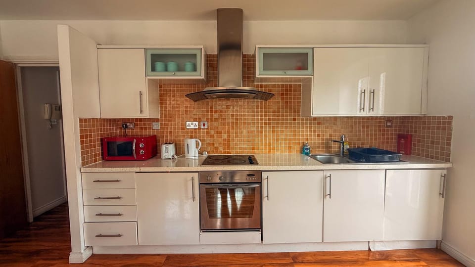 Kitchen or kitchenette, oven, stove