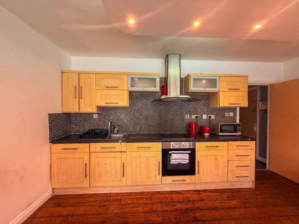Kitchen or kitchenette, stove, toaster