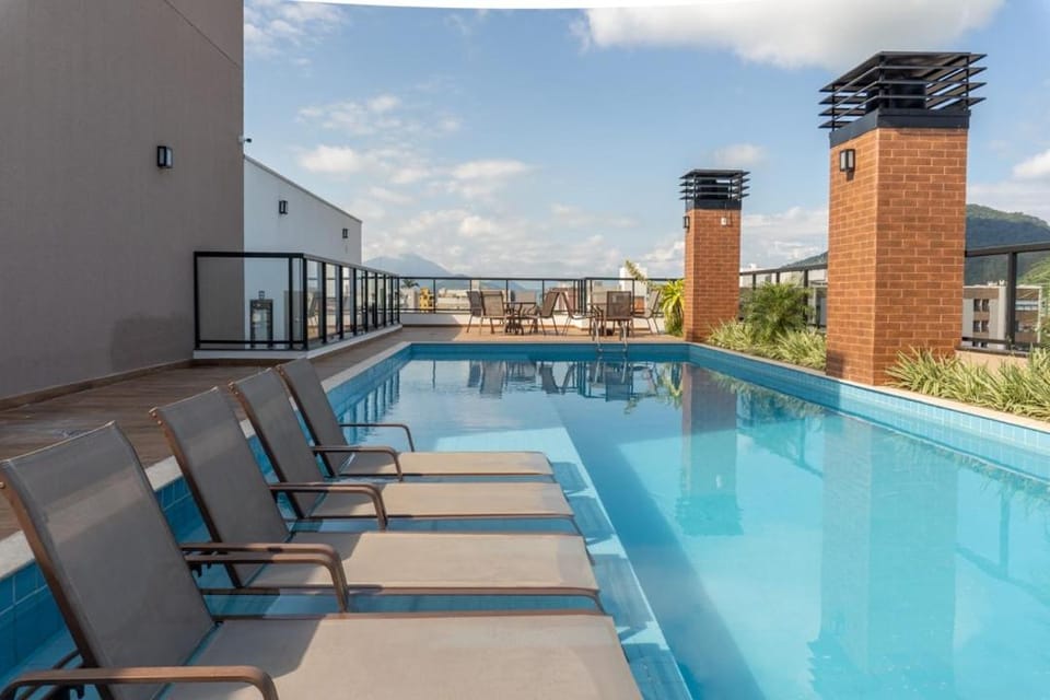 Apto novo com suíte churrasqueira e piscina Apartment in Ubatuba