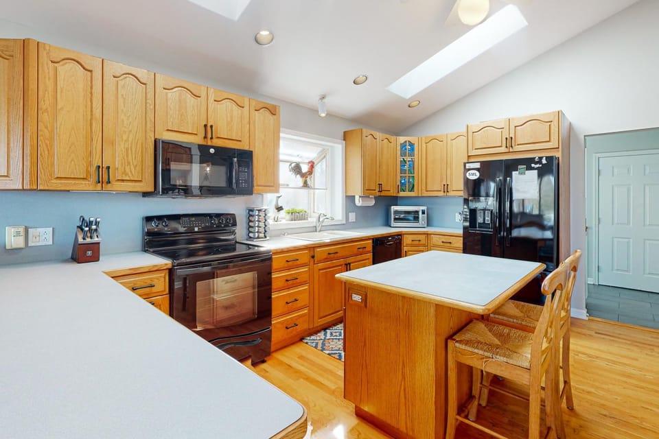 Kitchen or kitchenette, dishwasher, oven, stove, toaster