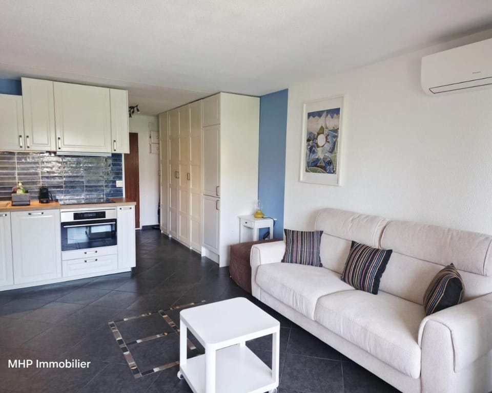 Living room, Seating area, Dining area, oven, stove, kitchen, air conditioner