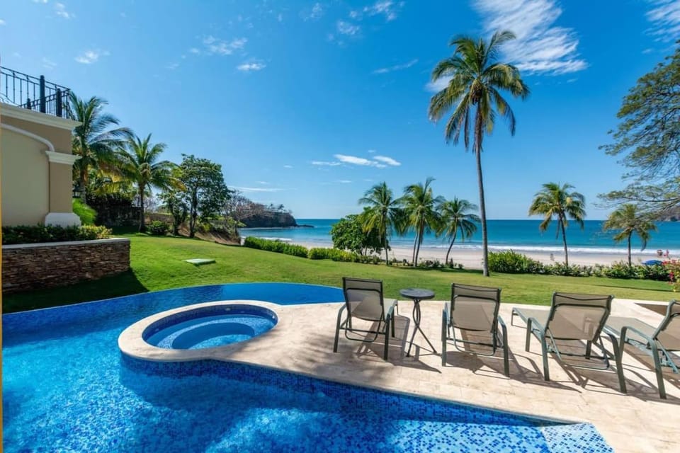 Elegant Mediterranean-Style Mansion with Beachfront Views and Private Infinity Pool House in Playa Flamingo