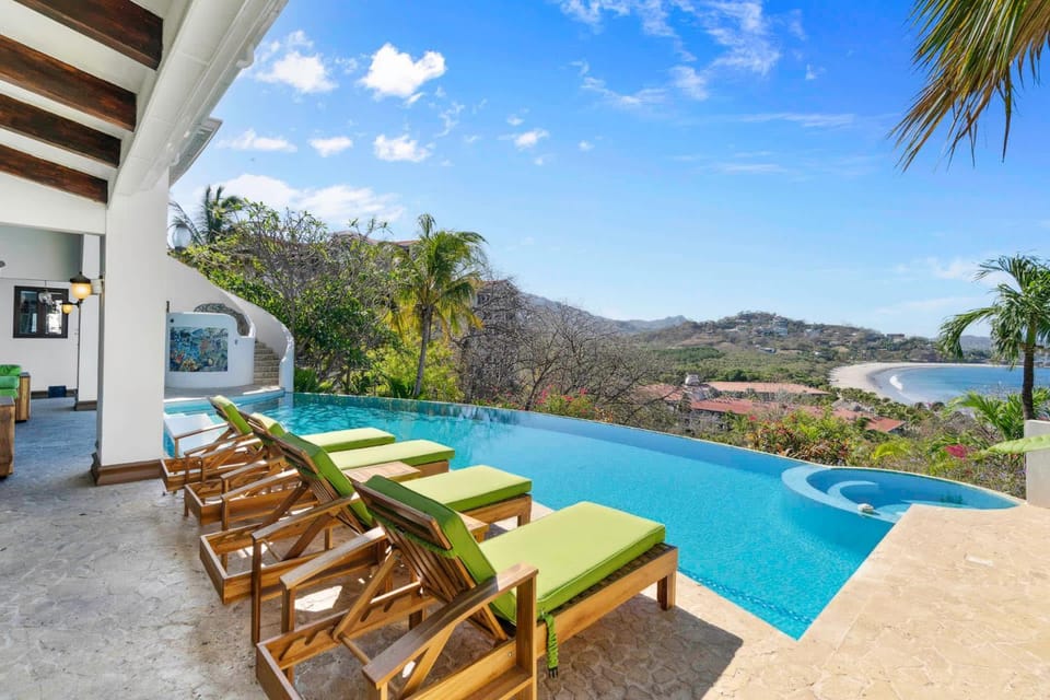 Dreamy Spanish-Style Villa with Sweeping Ocean Views, Elegant Nautical Design & Giant Infinity Pool House in Playa Flamingo