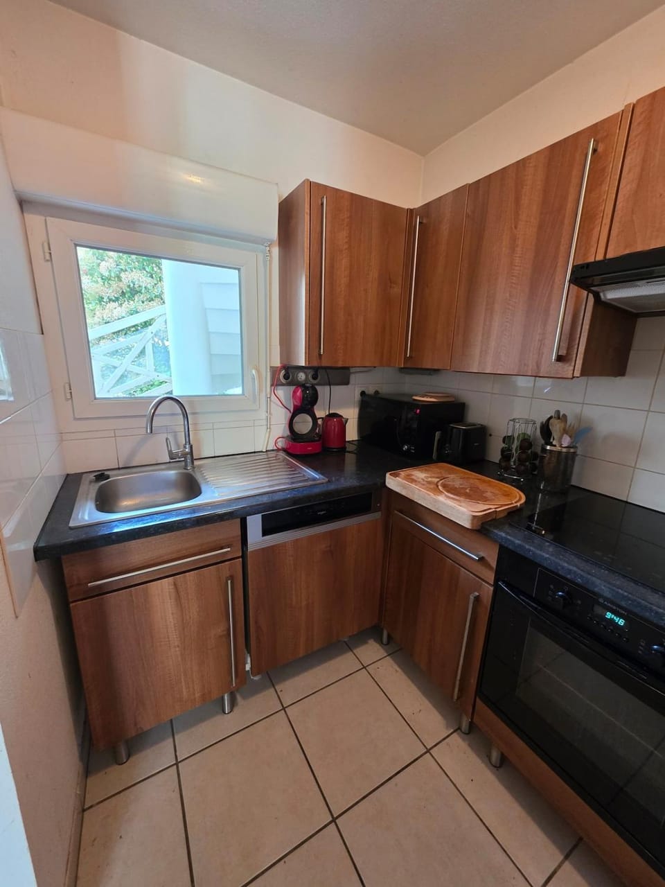 Kitchen or kitchenette, dishwasher, stove, toaster