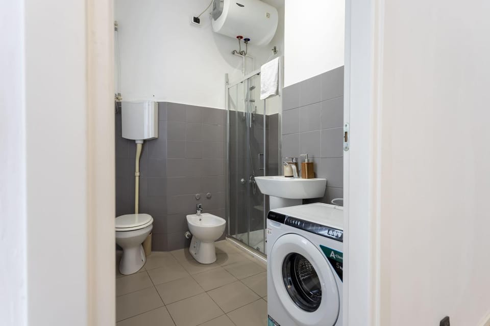 Shower, Toilet, Bathroom, bidet, towels, washing machine, dryer