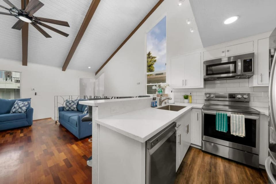 Kitchen or kitchenette, dishwasher, oven, stove