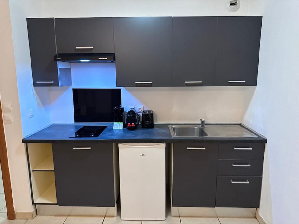 Kitchen or kitchenette, stove