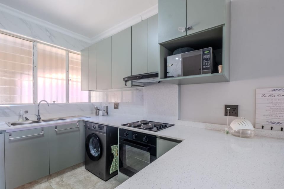 Kitchen or kitchenette, oven, stove, washing machine