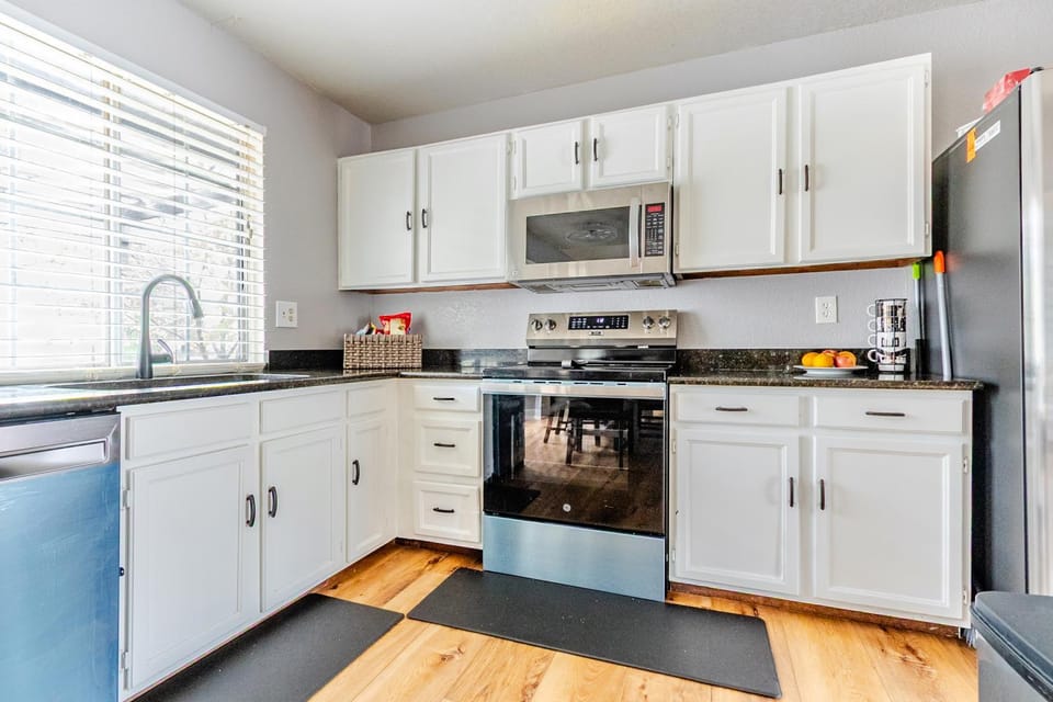 Kitchen or kitchenette, dishwasher, oven, stove, toaster