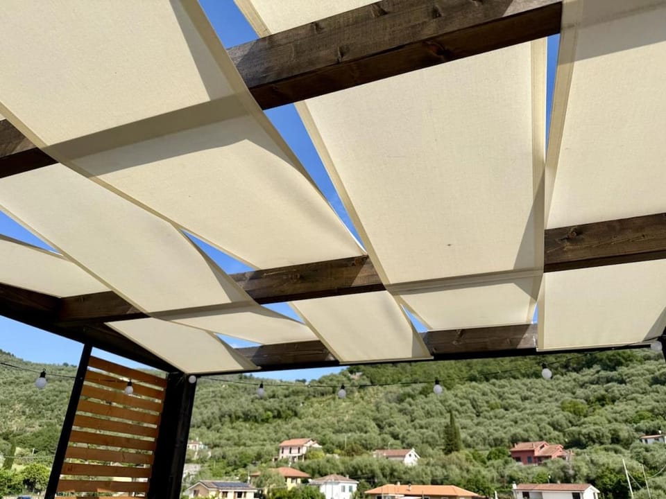 HOST4U - Dimora degli Ulivi, New Apartment with one Bedroom, Terrace and Parking, 10 minutes to the beach Apartment in Imperia