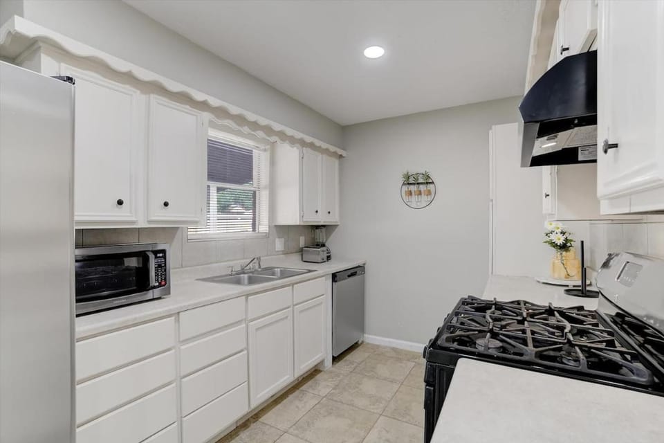 Kitchen or kitchenette, dishwasher, oven, stove, toaster