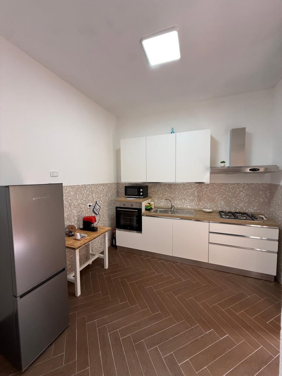 Kitchen or kitchenette, dishwasher, oven, stove, toaster