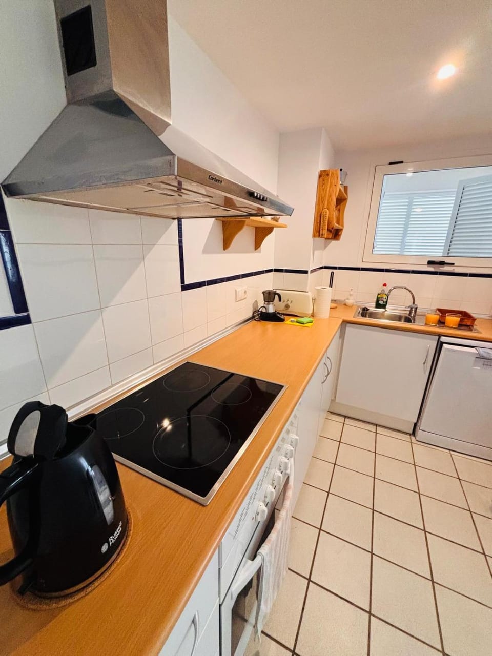 Kitchen or kitchenette, dishwasher, stove, toaster