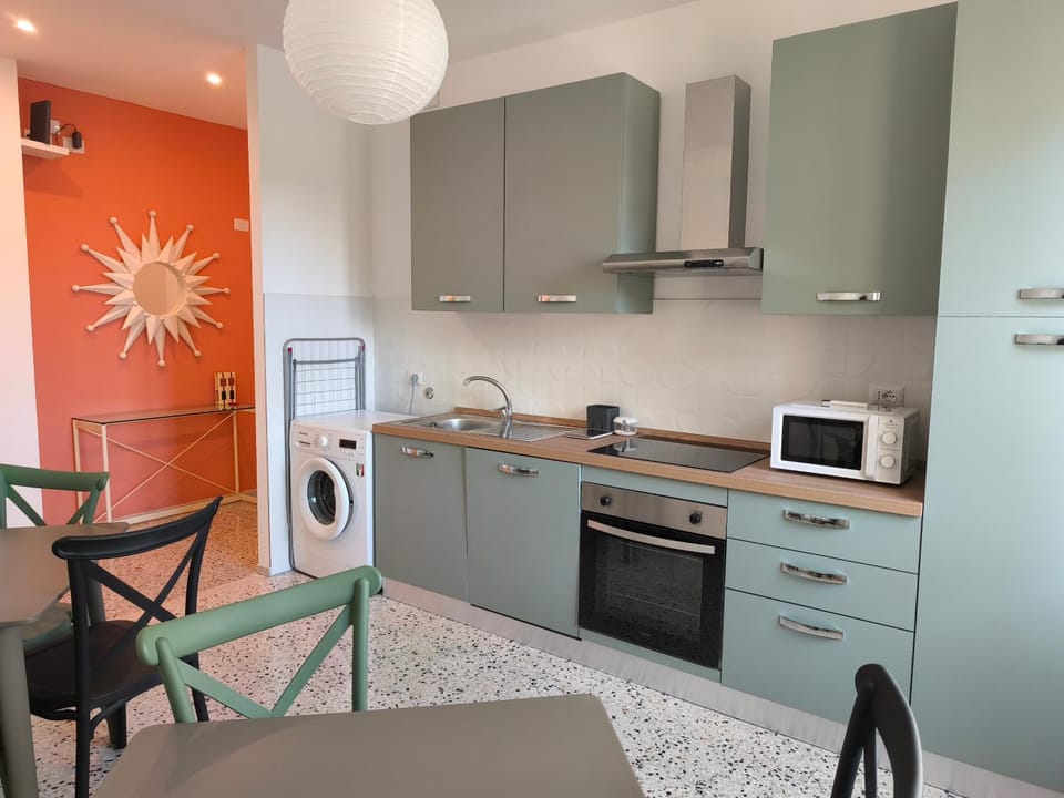 Kitchen or kitchenette, dishwasher, microwave, oven, stove, washing machine, kitchen
