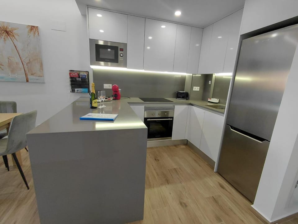 Kitchen or kitchenette, dishwasher, oven, stove, toaster