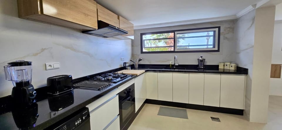 Kitchen or kitchenette, stove, toaster