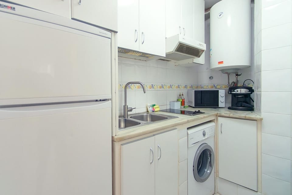 Kitchen or kitchenette, washing machine