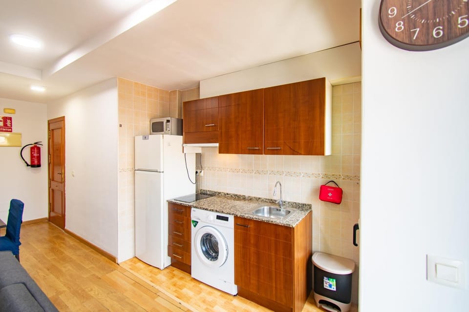 Kitchen or kitchenette, stove, washing machine