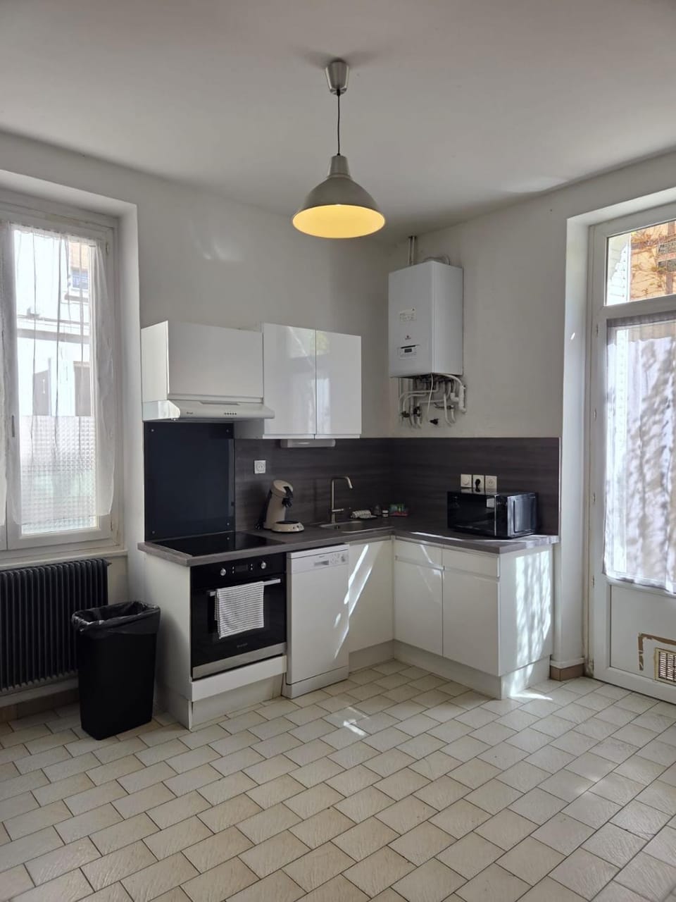 Kitchen or kitchenette, dishwasher, oven, stove
