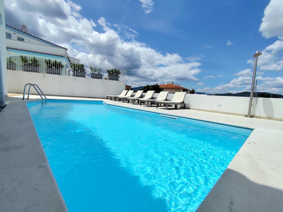 Villetta Borgo Bianco 2 con piscina in condivisione Villa in Budoni