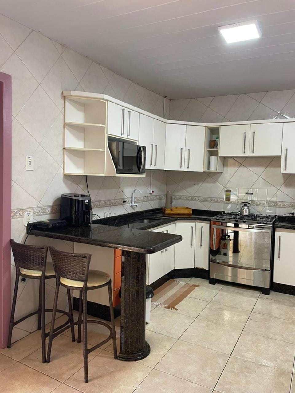 Kitchen or kitchenette, stove, toaster