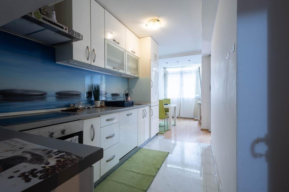 Kitchen or kitchenette, dishwasher, oven, stove
