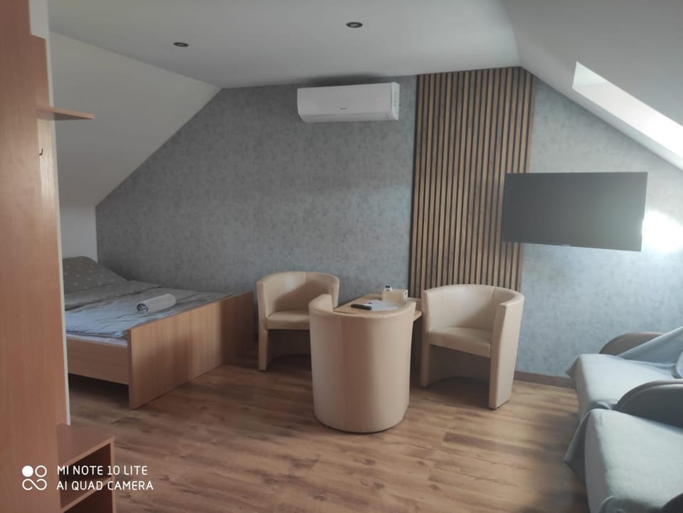 Photo of the whole room, Seating area, air conditioner