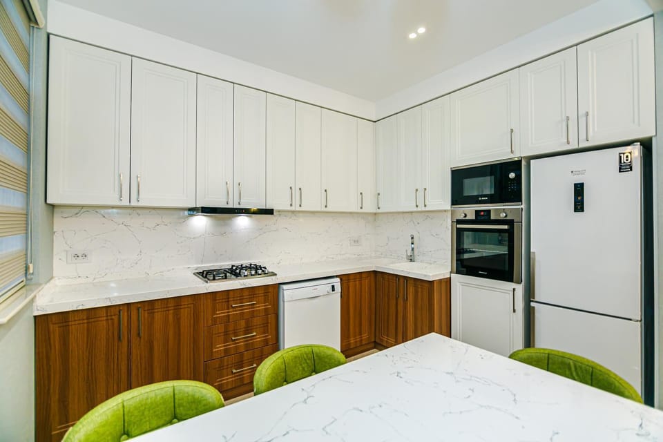 Kitchen or kitchenette, dishwasher, oven, stove
