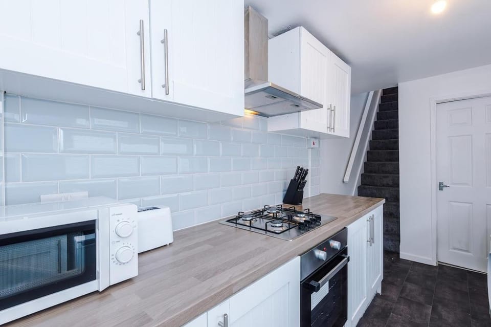 Kitchen or kitchenette, oven, stove, toaster