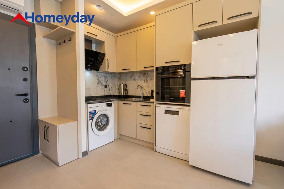 Kitchen or kitchenette, dishwasher, oven, stove, washing machine