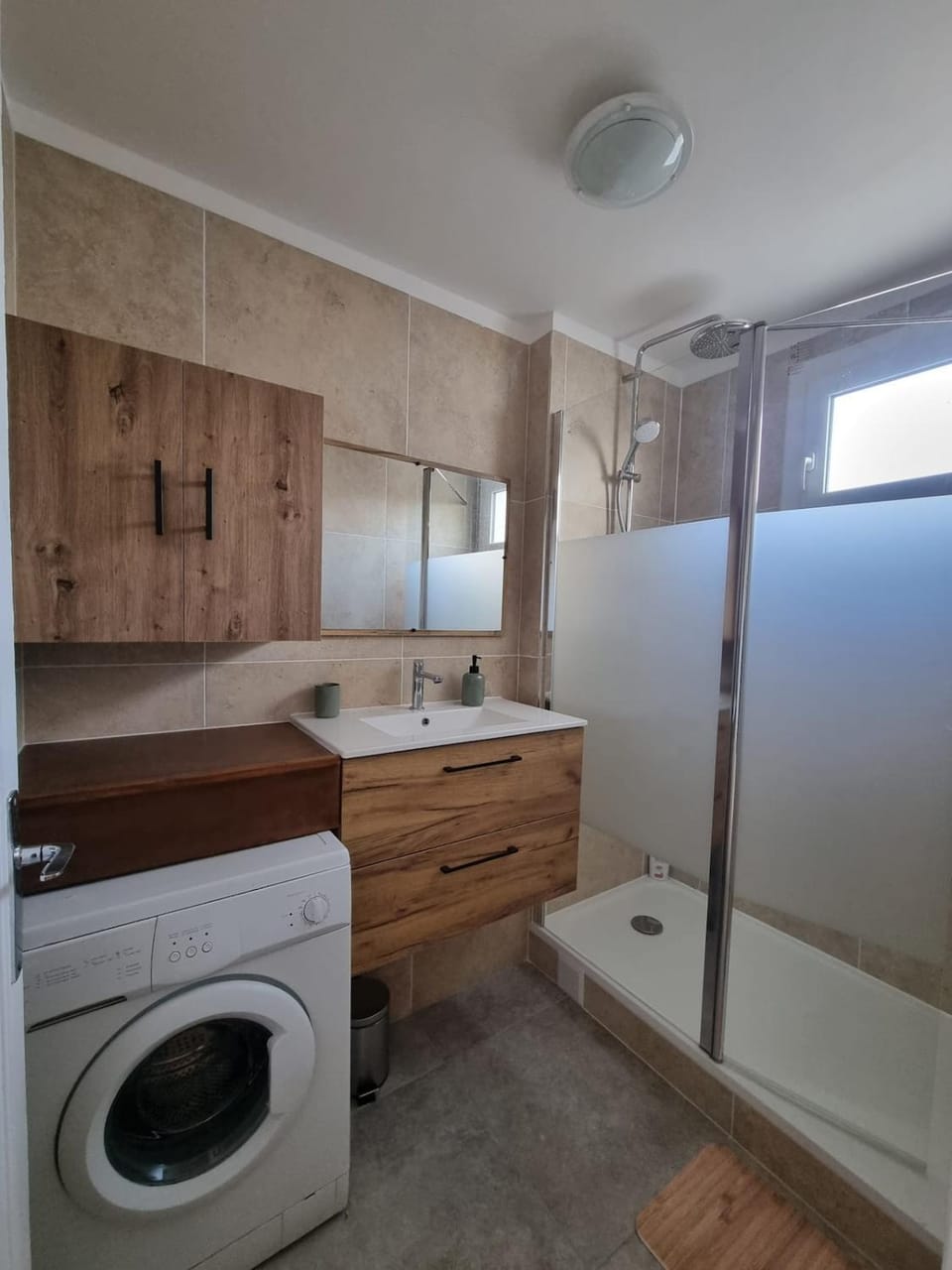 Shower, Bathroom, hair dryier, towels, washing machine