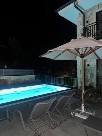 Property building, Night, Pool view, Swimming pool