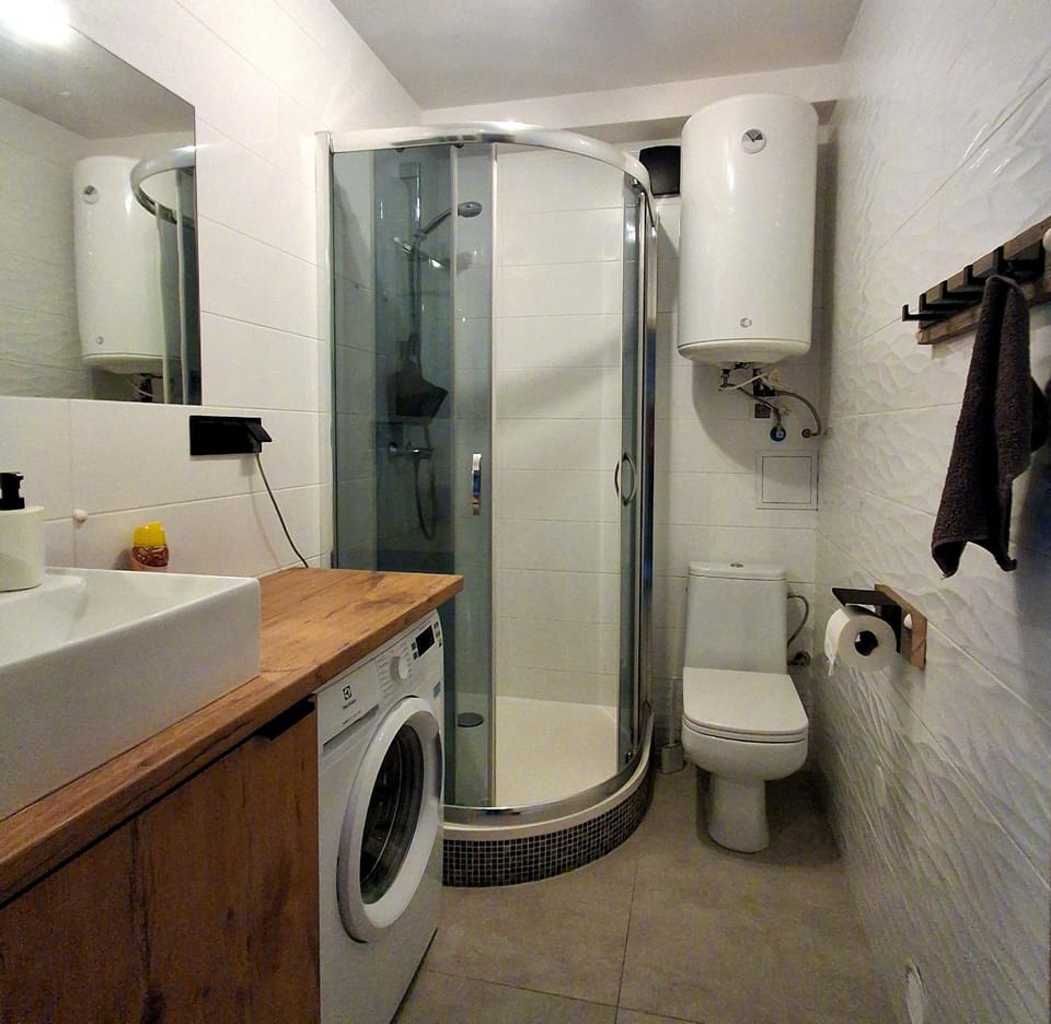 Shower, Toilet, Bathroom, towels, washing machine, dryer