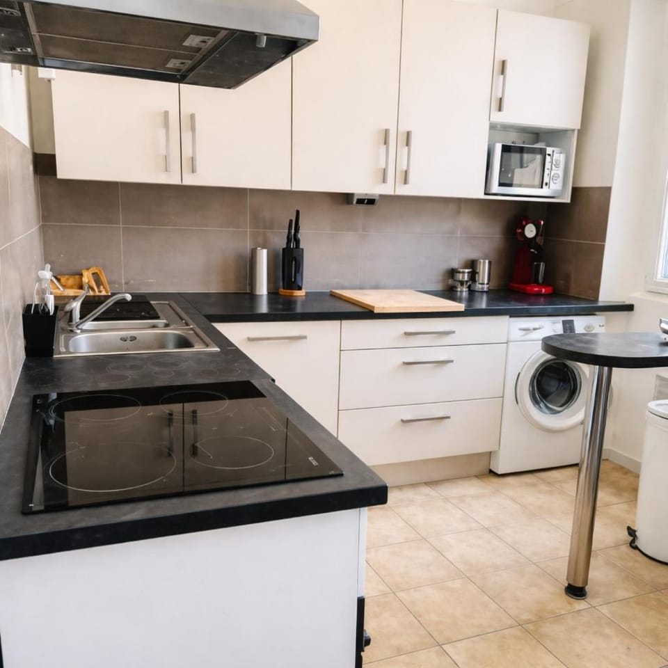Kitchen or kitchenette, dishwasher, microwave, oven, stove, washing machine