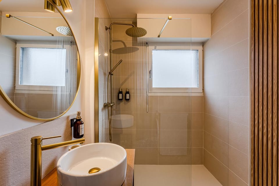Shower, Bathroom, hair dryier, towels, washing machine
