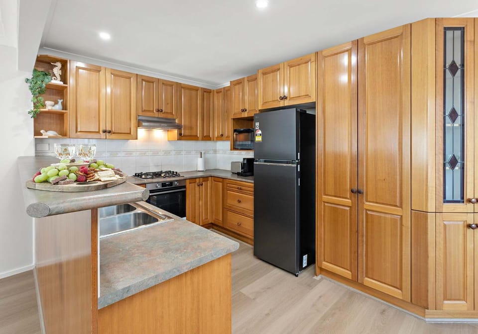 Kitchen or kitchenette, dishwasher, oven, stove