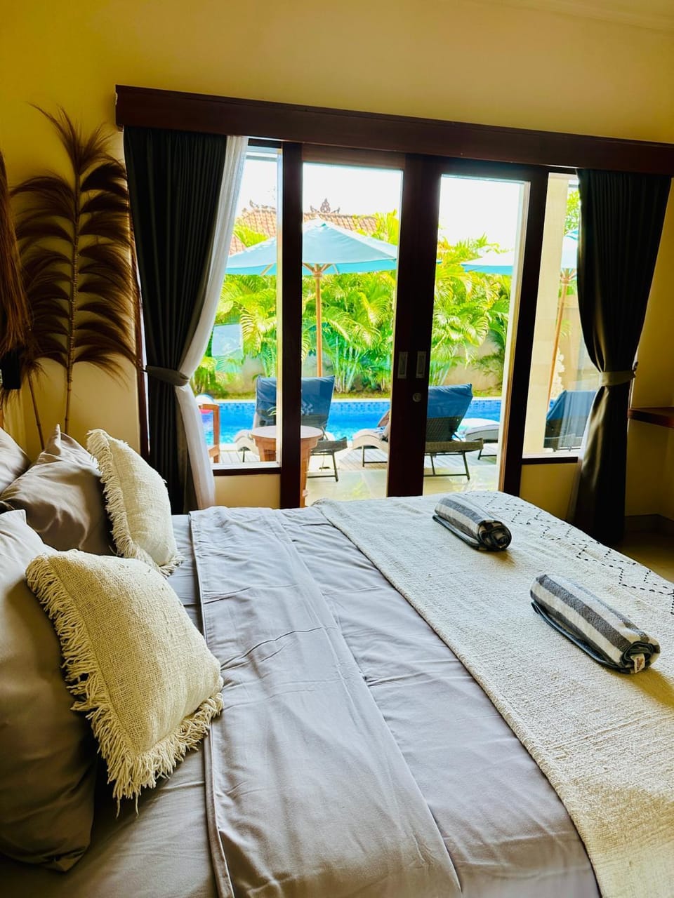 Bed, Bedroom, hair dryier, towels, air conditioner