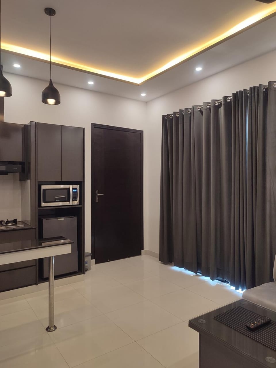 Living room, microwave, kitchen