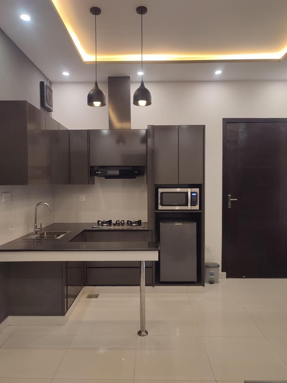 Kitchen or kitchenette, microwave, stove, kitchen