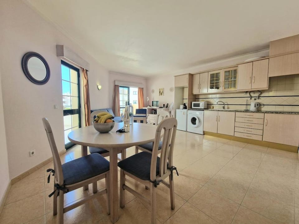Kitchen or kitchenette, microwave, stove, washing machine, kitchen