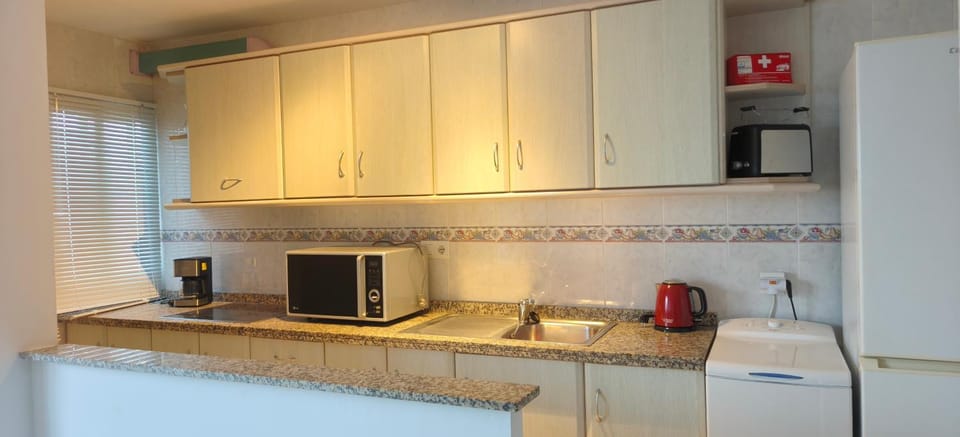 Kitchen or kitchenette, stove, toaster