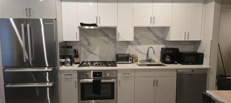 Kitchen or kitchenette, dishwasher, oven, stove, toaster