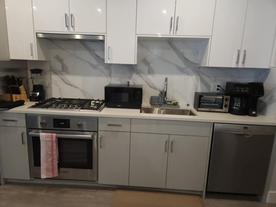 Kitchen or kitchenette, dishwasher, stove, toaster