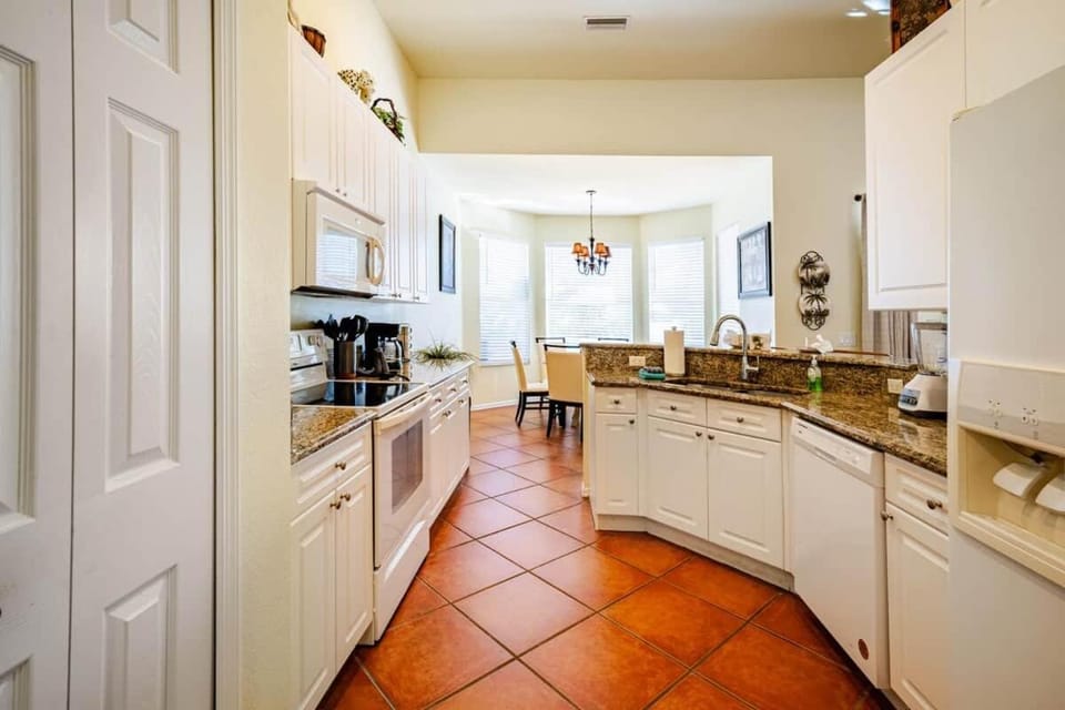 Kitchen or kitchenette, dishwasher, oven, stove
