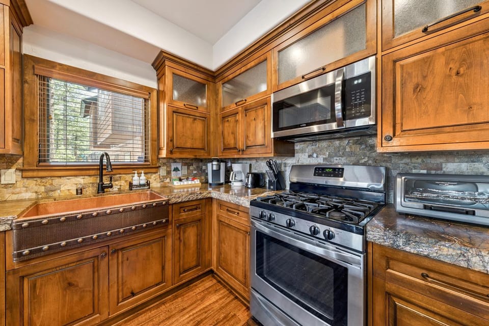 Kitchen or kitchenette, furniture, microwave, oven, stove, toaster