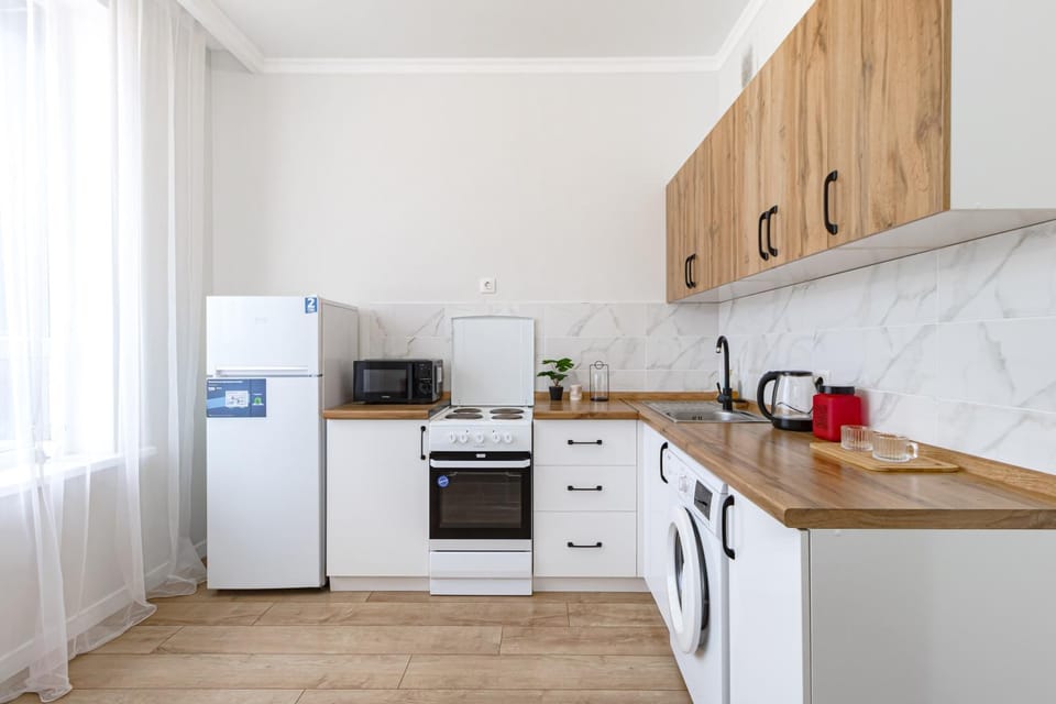 Kitchen or kitchenette, oven, stove, washing machine