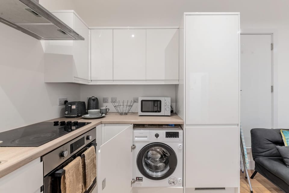 Kitchen or kitchenette, microwave, oven, stove, toaster